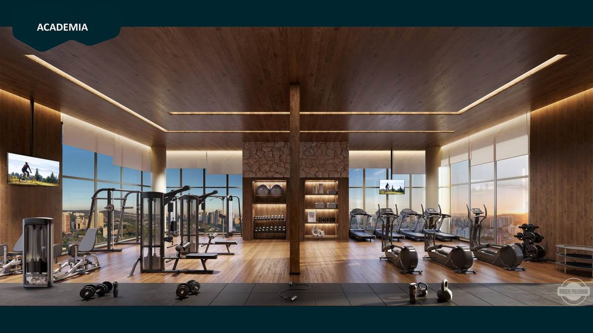 Academia panorâmica no 20º andar com teto de madeira e janelas do piso ao teto