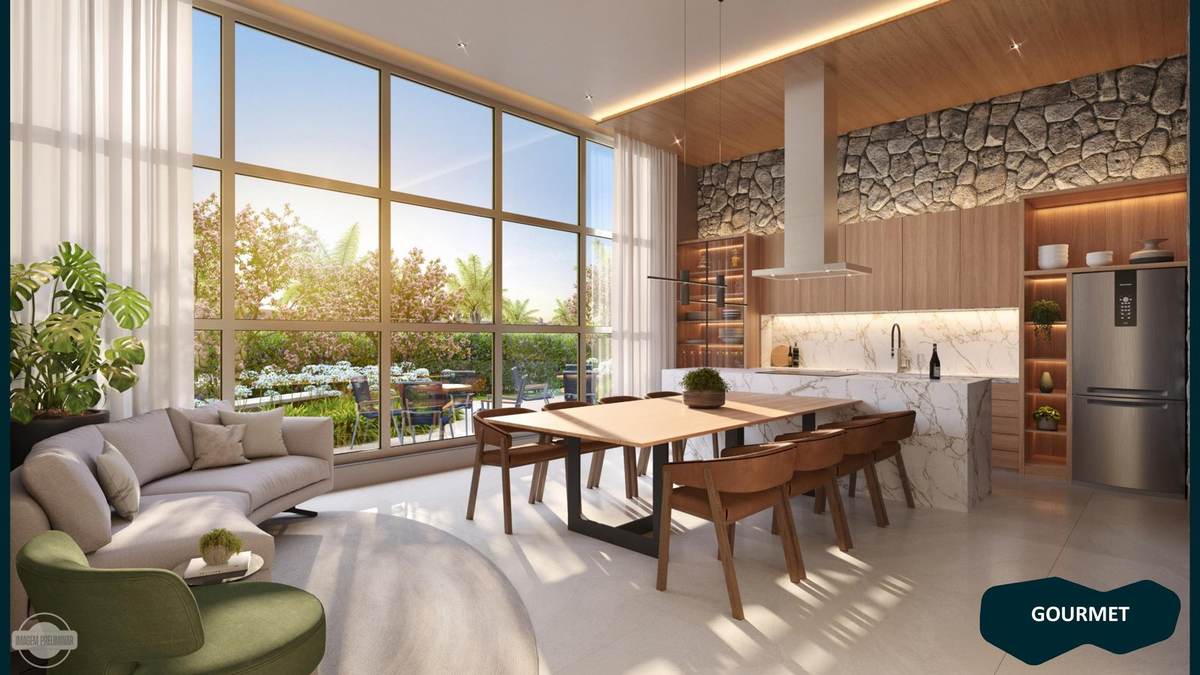 Espaço gourmet de pé-direito duplo com cozinha em mármore e vista para o jardim